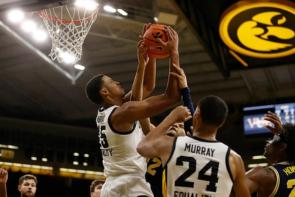 Hunter Dickinson (1), DeVante' Jones (12), and Jace Howard (25)