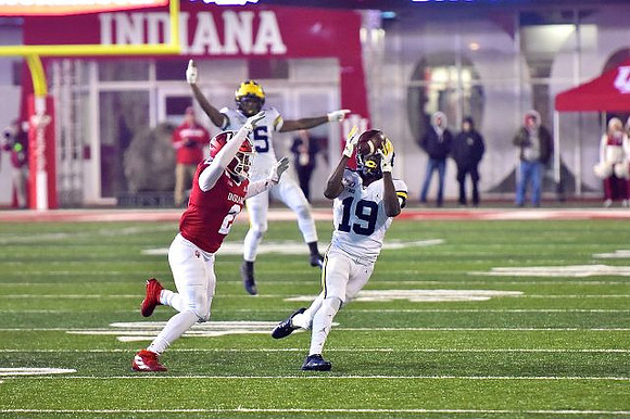 Giles Jackson (15) and Mike Sainristil (19)