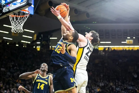 Moussa Diabate (14) and DeVante' Jones (12)