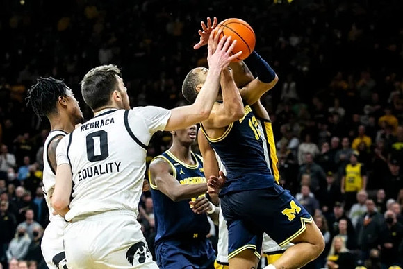 DeVante' Jones (12) and Moussa Diabate (14)
