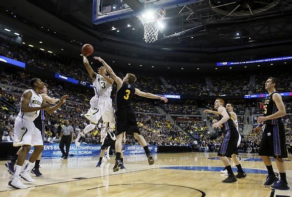 Glenn Robinson III (1) and Trey Burke (3)
