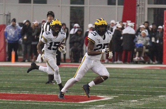 Giles Jackson (15) and Hassan Haskins (25)