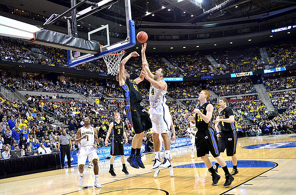 Glenn Robinson III (1), Mitch McGary (4), and Tim Hardaway Jr. (10)