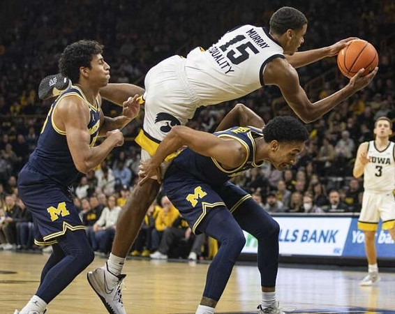 Kobe Bufkin (2) and Eli Brooks (55)
