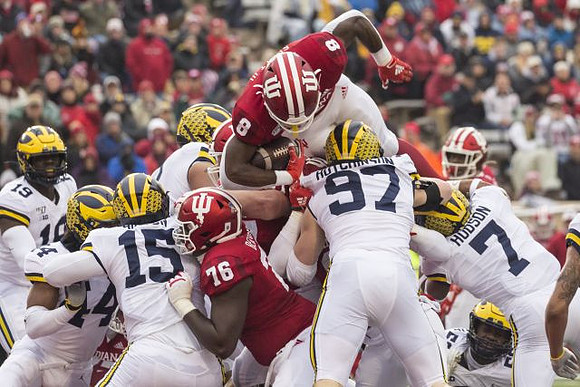 Kwity Paye (19), Cameron McGrone (44), Christopher Hinton (15), Aidan Hutchinson (97), and Khaleke Hudson (7)