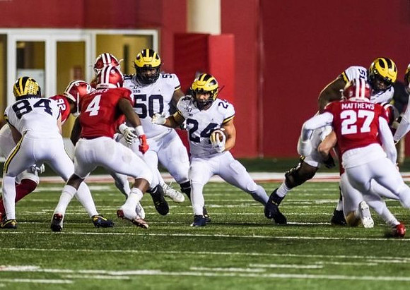 Sean McKeon (84), Michael Onwenu (50), Zach Charbonnet (24), and Cesar Ruiz (51)