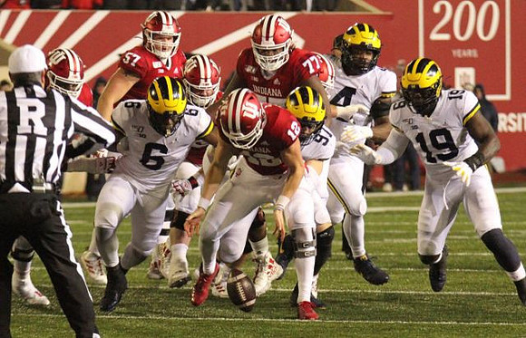 Josh Uche (6), Aidan Hutchinson (97), Michael Danna (4), and Kwity Paye (19)