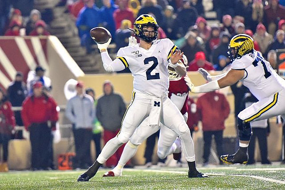 Shea Patterson (2) and Jon Runyan Jr. (75)
