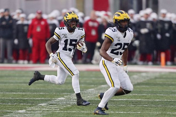 Giles Jackson (15) and Hassan Haskins (25)