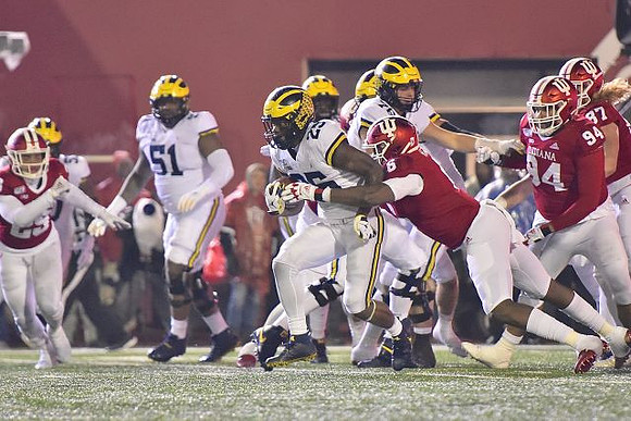 Cesar Ruiz (51), Ryan Hayes (76), and Hassan Haskins (25)
