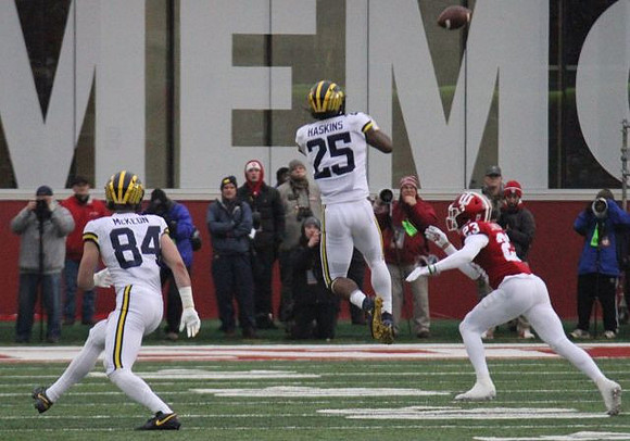 Sean McKeon (84) and Hassan Haskins (25)