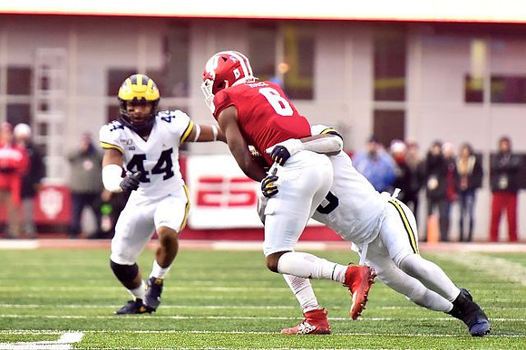 Cameron McGrone (44) and Josh Uche (6)