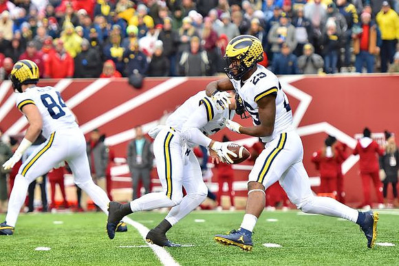 Sean McKeon (84), Shea Patterson (2), and Hassan Haskins (25)
