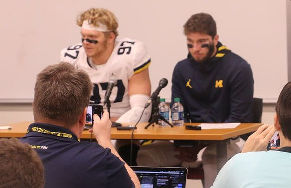 Aidan Hutchinson (97) and Shea Patterson (2)