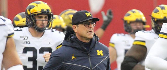 Camaron Cheeseman (33) and Jim Harbaugh