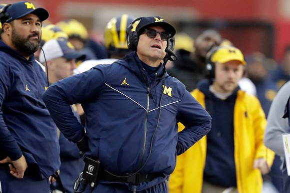 Shaun Nua and Jim Harbaugh