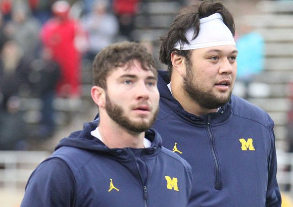 Shea Patterson (2) and Chuck Filiaga (66)