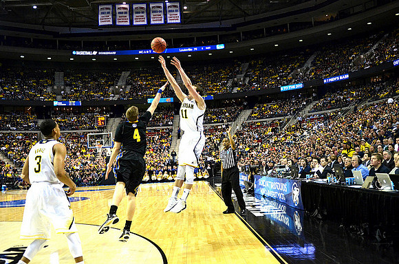Trey Burke (3) and Nik Stauskas (11)