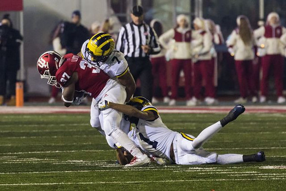 Khaleke Hudson (7) and Ambry Thomas (1)