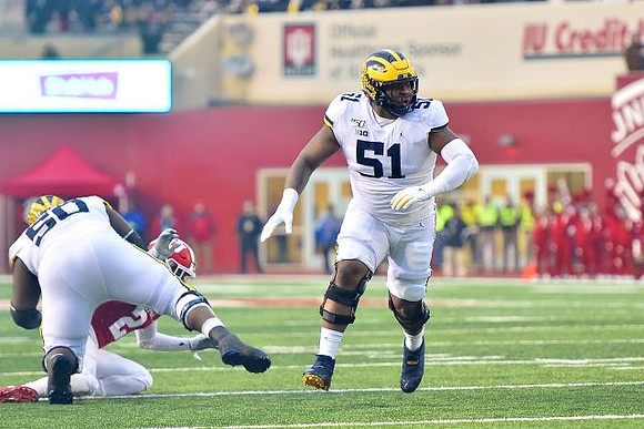 Michael Onwenu (50) and Cesar Ruiz (51)