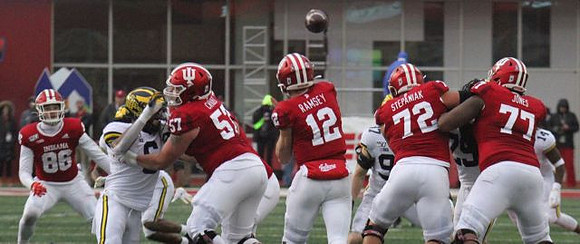 Josh Uche (6) and Aidan Hutchinson (97)