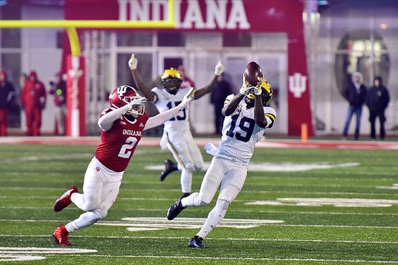Giles Jackson (15) and Mike Sainristil (19)