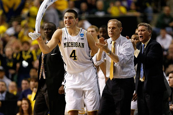 Bacari Alexander, Mitch McGary (4), John Beilein, and Jeff Meyer