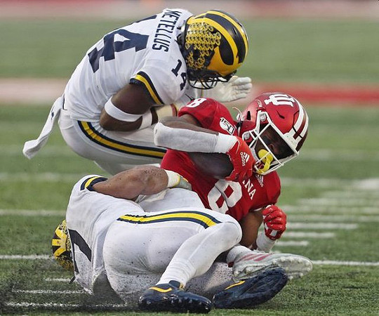 Josh Metellus (14) and Khaleke Hudson (7)