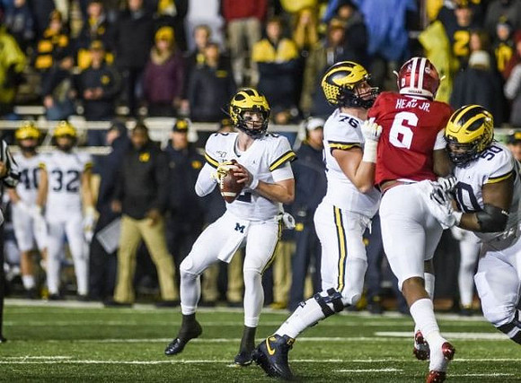 Shea Patterson (2), Ryan Hayes (76), and Michael Onwenu (50)