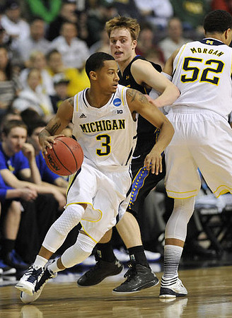 Trey Burke (3) and Jordan Morgan (52)
