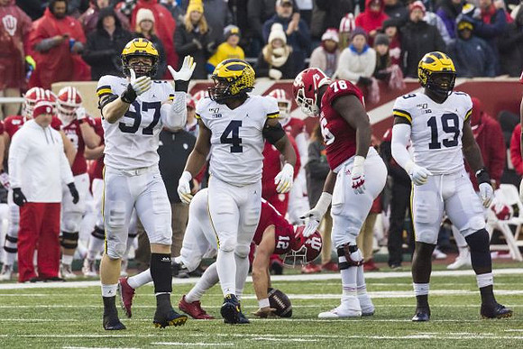 Aidan Hutchinson (97), Michael Danna (4), and Kwity Paye (19)