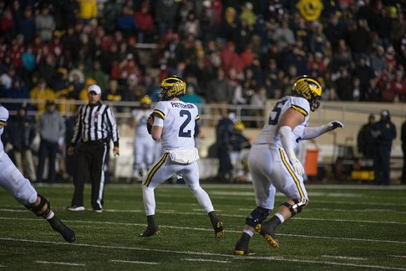 Shea Patterson (2) and Jon Runyan Jr. (75)