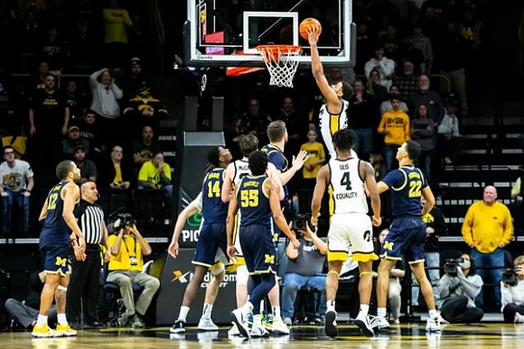 DeVante' Jones (12), Moussa Diabate (14), Eli Brooks (55), Caleb Houstan (22), and Hunter Dickinson (1)