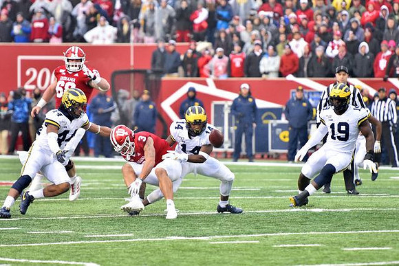 Cameron McGrone (44), Josh Metellus (14), and Kwity Paye (19)