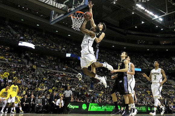 Glenn Robinson III (1), Mitch McGary (4), and Trey Burke (3)