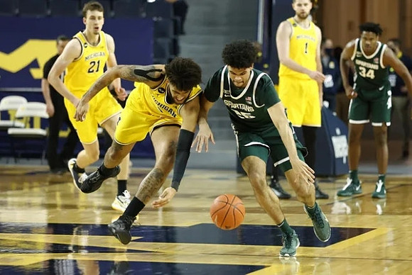 Franz Wagner (21), Isaiah Livers (2), and Hunter Dickinson (1)