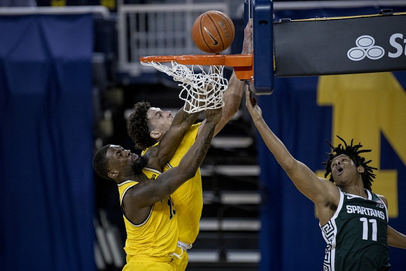 Chaundee Brown Jr. (15) and Brandon Johns Jr. (23)