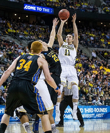 Nik Stauskas (11) and Jon Horford (15)