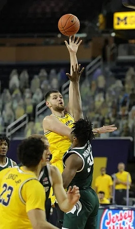 Brandon Johns Jr. (23) and Hunter Dickinson (1)