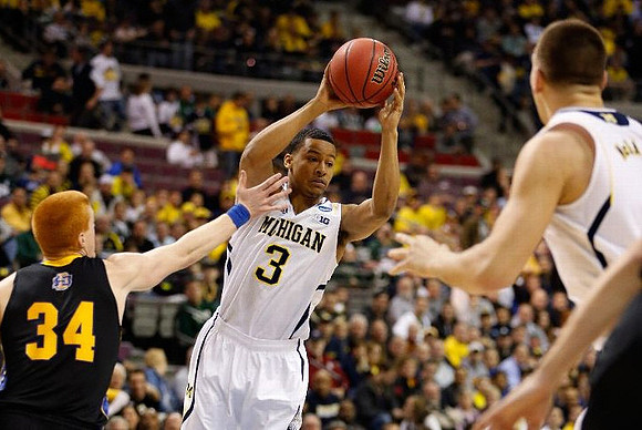Trey Burke (3) and Mitch McGary (4)