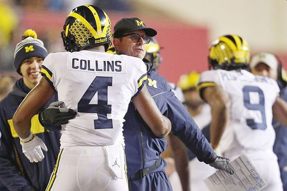 Nico Collins (4), Jim Harbaugh, and Donovan Peoples-Jones (9)