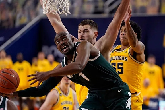 Hunter Dickinson (1), Eli Brooks (55), and Franz Wagner (21)