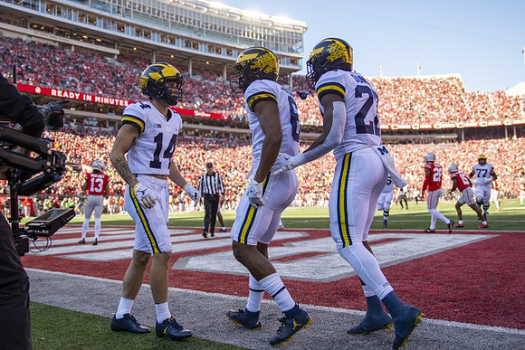 Roman Wilson (14), Cornelius Johnson (6), Tavierre Dunlap (22), and Trevor Keegan (77)