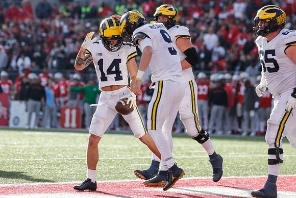 Roman Wilson (14), J.J. McCarthy (9), and Zak Zinter (65)