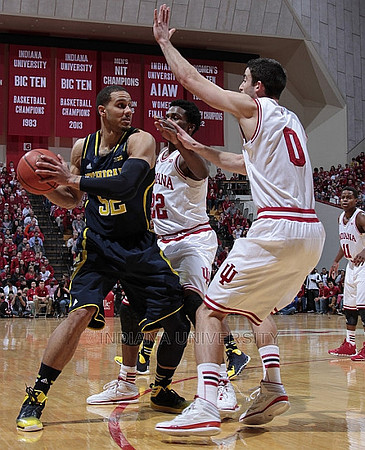 Derrick Walton Jr. (10), Jordan Morgan (52), and Zak Irvin (21)