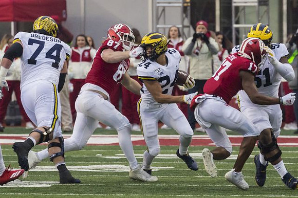 Ben Bredeson (74), Zach Charbonnet (24), and Cesar Ruiz (51)