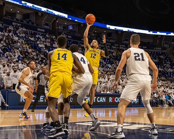 Moussa Diabate (14) and DeVante' Jones (12)