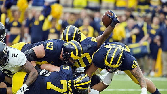 Kyle Kalis (67), Erik Magnuson (78), Khalid Hill (80), and Mason Cole (52)