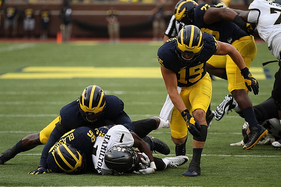 Ryan Glasgow (96), Chase Winovich (15), and Maurice Hurst (73)