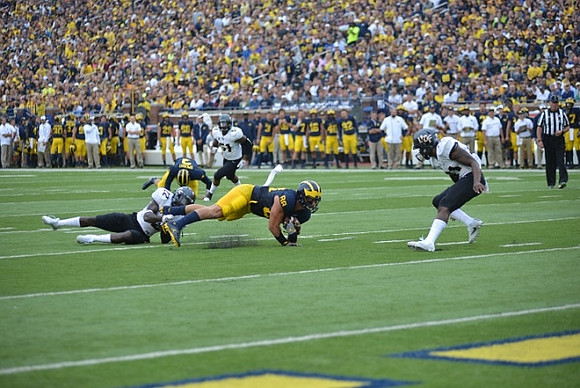 Wilton Speight (3) and Jake Butt (88)